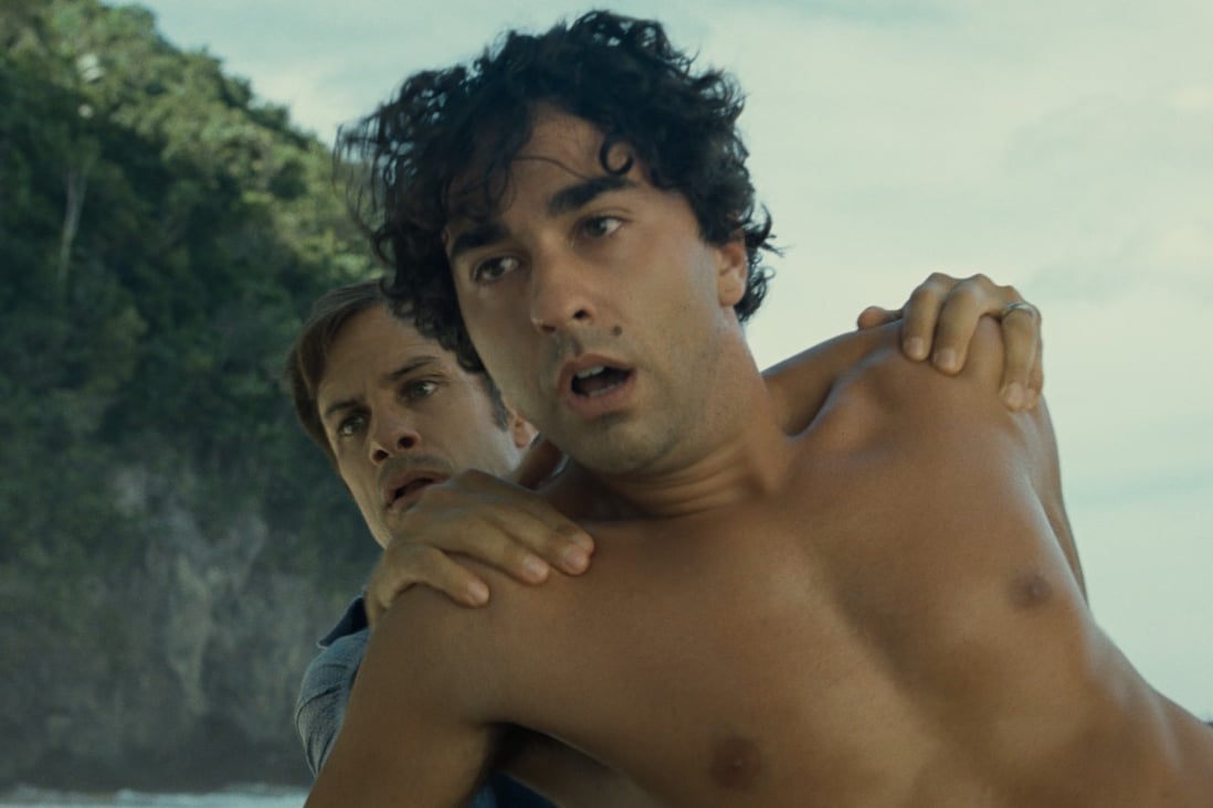 Alex Wolff (front) and Gael García Bernal in a scene from beach horror Old (category: IIB), written and directed by M. Night Shyamalan.