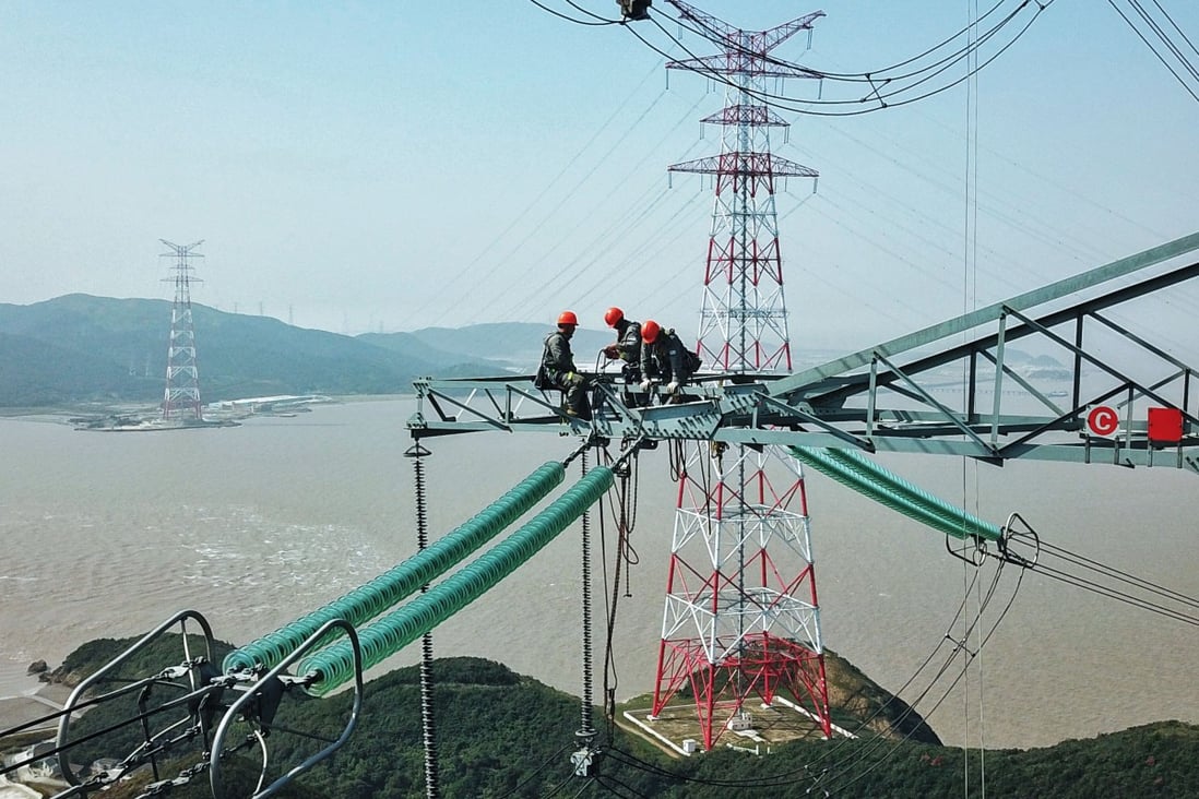 Technicians from the State Grid Zhejiang Electric Power Company, a subsidiary of the national power company State Grid, check power lines in Zhoushan, Zhejiang. In China, state-owned enterprises employ about a fifth of the labour force – about 70 million people – the equivalent of almost the entire population of France. Photo: Xinhua