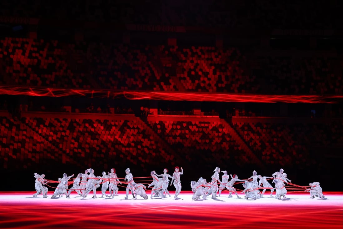 Performers put on a show before empty stands at the Tokyo 2020 Olympics opening ceremony on July 23. Photo: Reuters