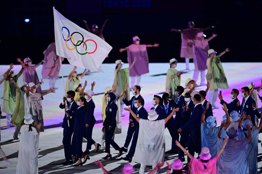 The Refugee Olympic Team’s delegation walks in the athletes’ parade at the opening ceremony of the Tokyo 2020 Olympic Games on July 23. Photo: AFP