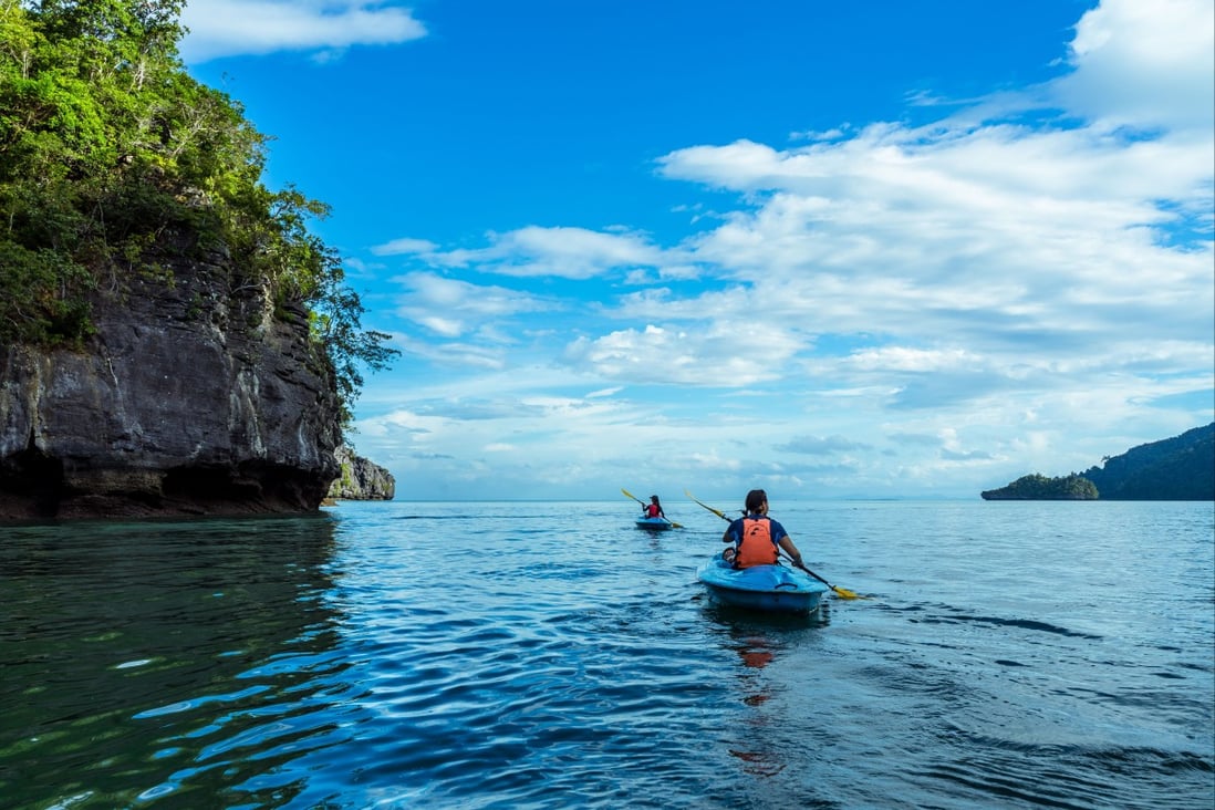 Tourists explore one of Langkawi’s many jungle-clad islands by kayak. Photo: courtesy of Dev’s Adventure Tours