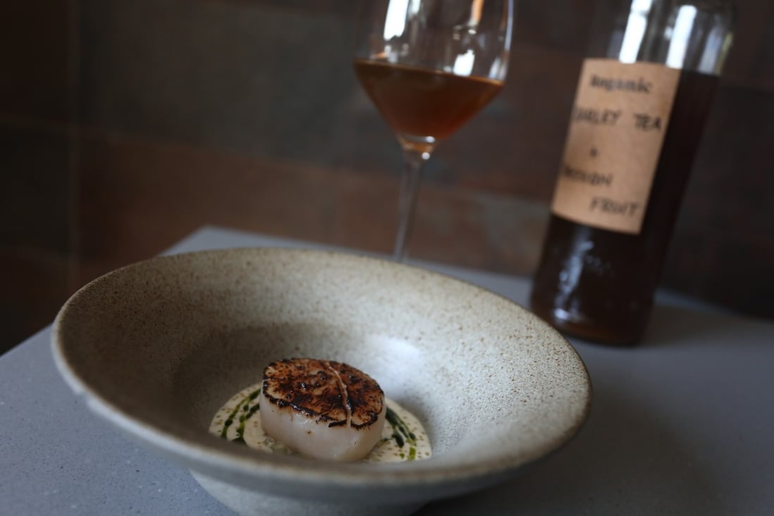 Barley tea and passionfruit paired with scallop, celtuce, pike perch at Aulis in Causeway Bay. At this and other Hong Kong restaurants, non-alcoholic drink and food pairings take the same care as food and wine pairings. Photo: Jonathan Wong