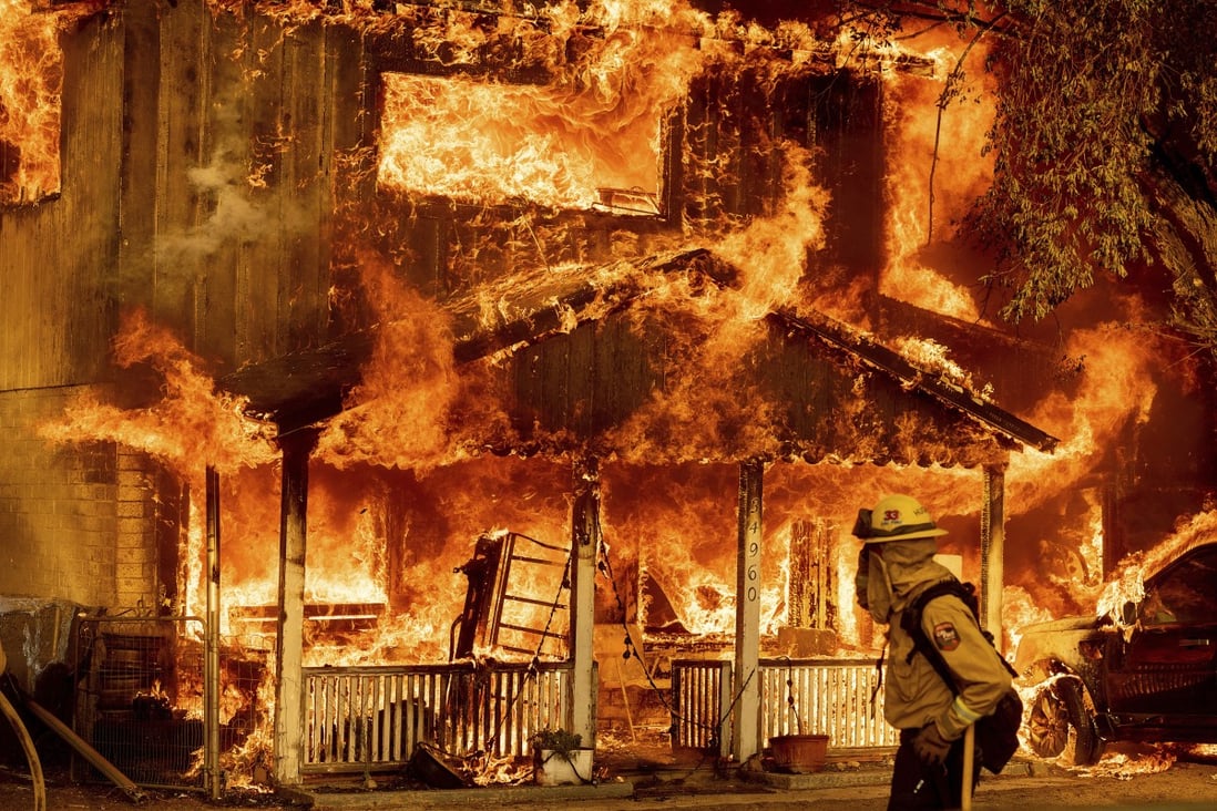 Fire consumes a home as the Sugar fire tears through Doyle, California, on July 10. The world is likely to reach 1.5 degrees Celsius of warming within 20 years, warns the latest report from the UN’s Intergovernmental Panel on Climate Change. Photo: AP 
