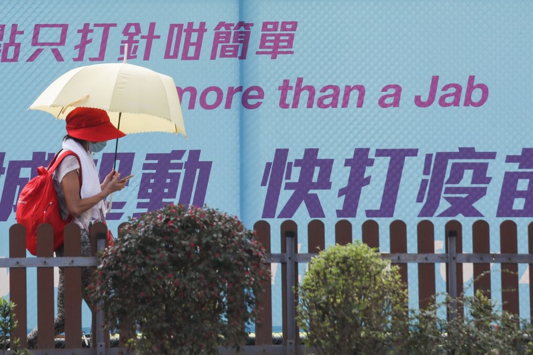 A pedestrian walks past a poster for Hong Kong’s vaccination campaign on August 12. Photo: Xiaomei Chen