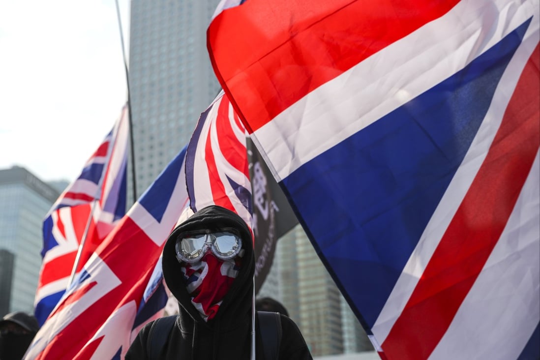An anti-government demonstrator with the British flag during the Hong Kong protests. The option of converting BN(O) passports into something useful is proving alluring for some. Photo: Sam Tsang