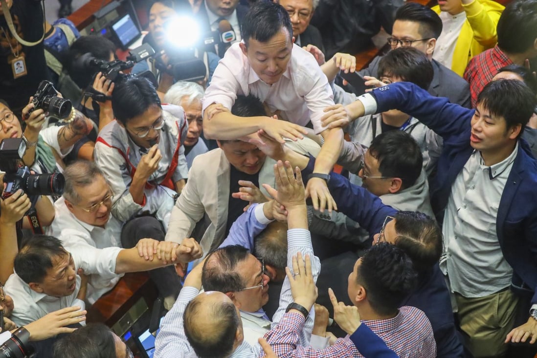Lawmaker Abraham Razack (bottom centre) is surrounded by other legislators during a meeting on the Fugitive Offenders Bill at the Legislative Council on May 11, 2019. Beijing lost patience with the shenanigans in Legco. Photo: Edmond So