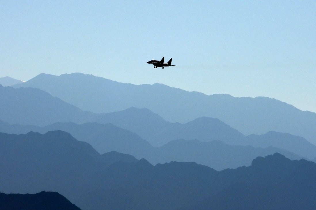 An Indian Air Force fighter jet flies over a mountain range in Leh, the joint capital of the union territory of Ladakh, bordering China, in September 2020. Photo: AFP