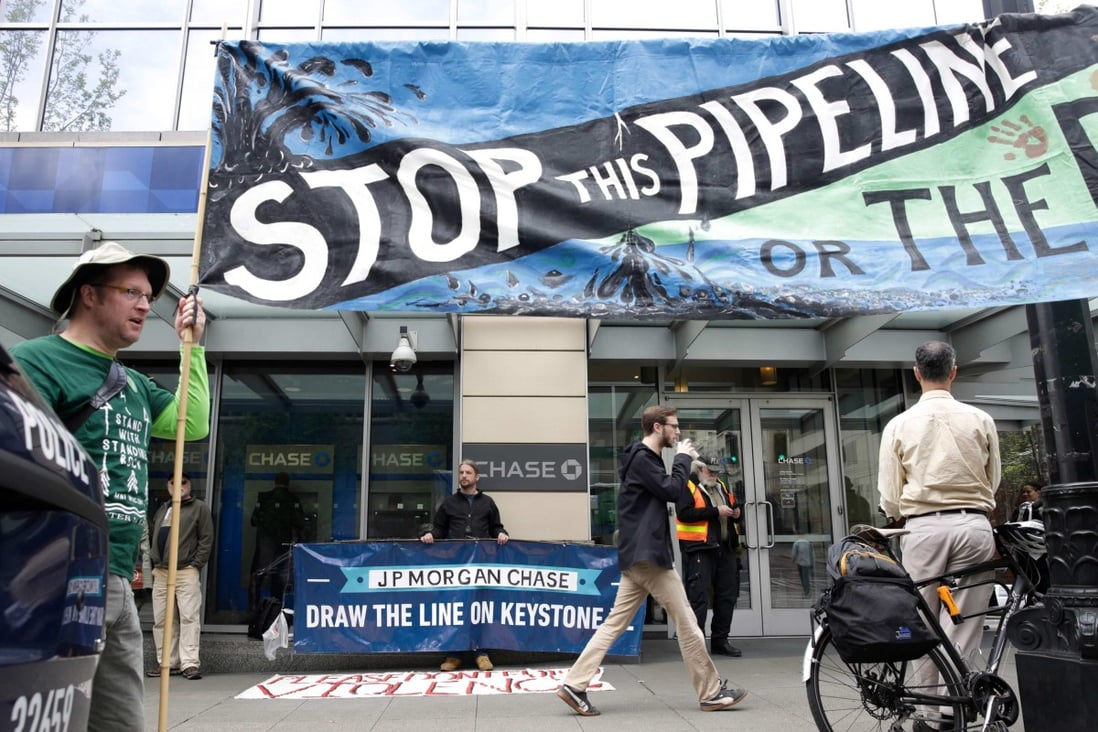 Indigenous leaders and climate activists protest against the Keystone XL oil pipeline in Seattle on May 8, 2017. Biden has revoked the project’s permit as he pursues climate-friendly policies to meet the demands of the Democratic Party’s Green New Deal base. Photo: AFP