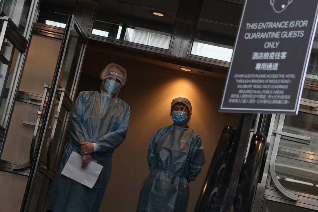 Staff members stand ready outside the Sheraton Hong Kong Hotel, one of the city’s designated quarantine hotels, in Tsim Sha Tsui, on June 22. Photo: K.Y. Cheng