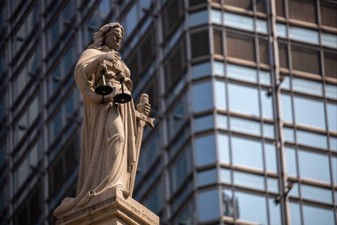 A statue of Lady Justice sits on top of the Court of Final Appeal in Hong Kong’s Central district. The fundamental rights guaranteed by Article 35 of the Basic Law include access to the courts and the right to institute legal proceedings against the acts of the executive authorities. Photo: EPA-EFE