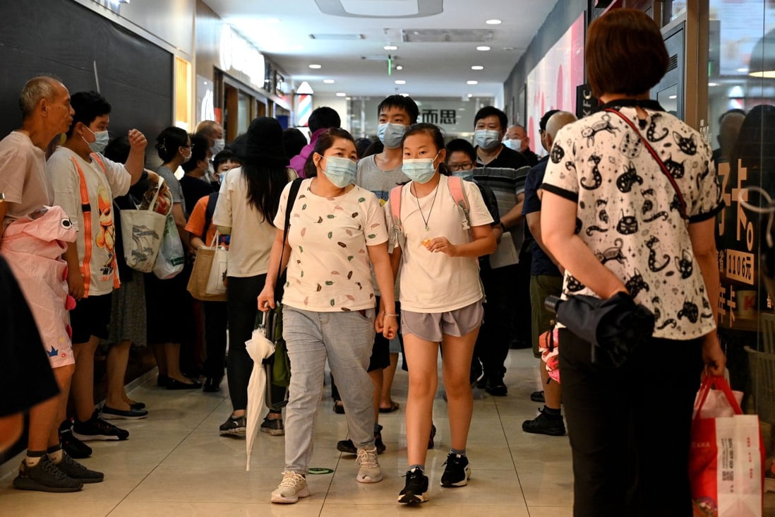Students and parents come away from a tutoring centre in Beijing’s Haidian district on July 29. China’s crackdown on after-school tutoring has affected the market value of education companies. Photo: AFP