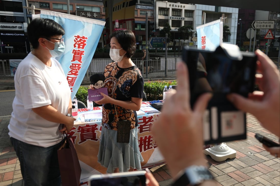 Shun Tak Holdings chairwoman Pansy Ho talks to a supporter in Sheung Wan on September 11. Photo: Xiaomei Chen