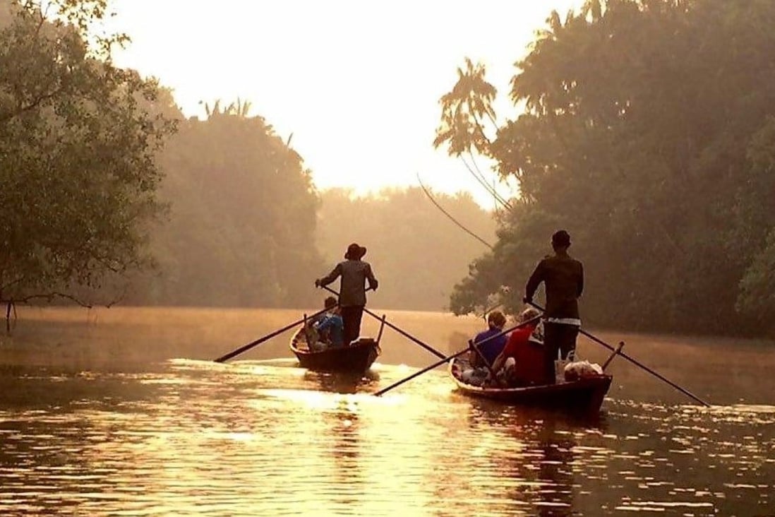 Tourists enjoy a boat trip in Chi Phat, Cambodia. A World Bank initiative is promoting eco-tourism in the country to make the industry more sustainable and boost nature conservation in the Southeast Asian country.