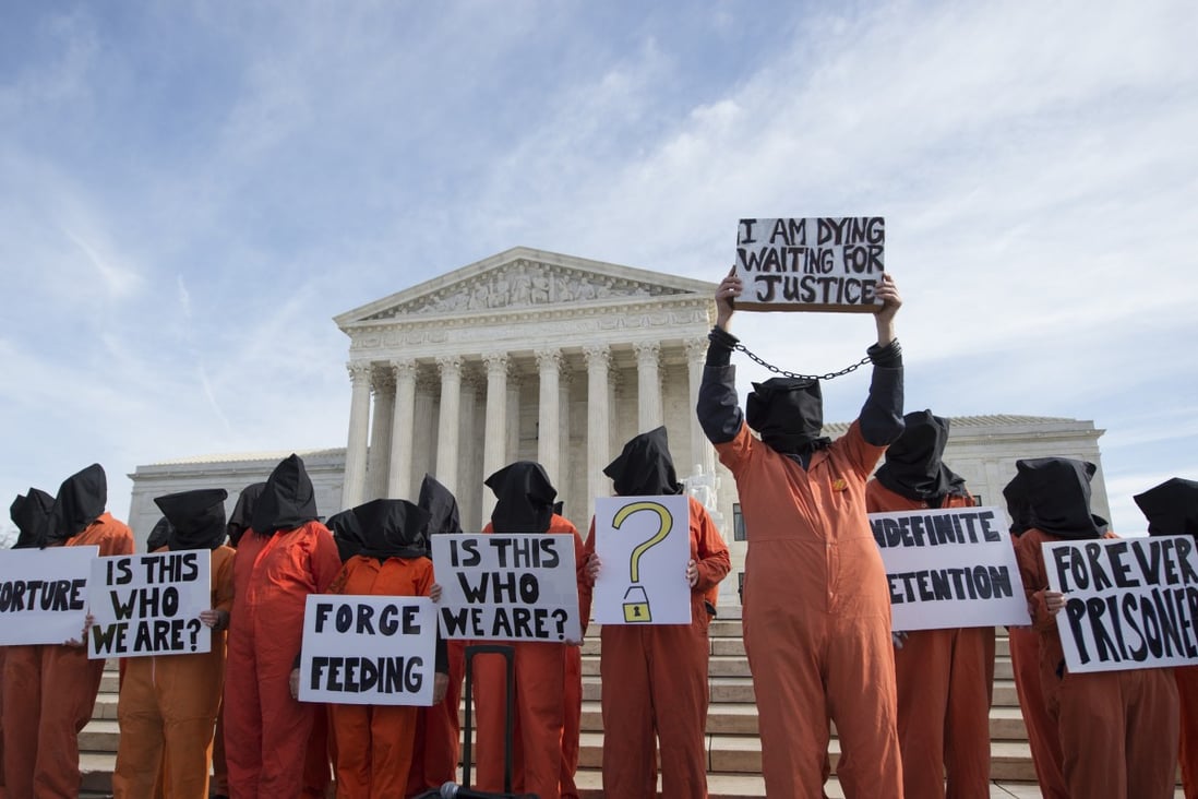 Protesters participate in a rally outside the Supreme Court in Washington on January 11, 2017, calling for the closing of the Guantanamo Bay prison and marking the 15th anniversary of the arrival of the first Afghan prisoners at the detention centre. Photo: AP 