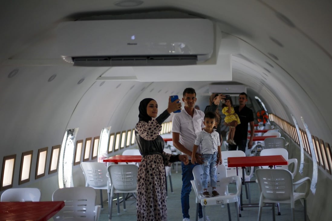 Palestinians visit the interior of a Boeing 707 converted to a cafe restaurant in Wadi Al-Badhan, near the West Bank city of Nablus. Photo: AP
