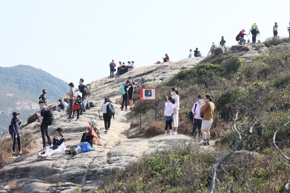 People hike Dragon’s Back over Lunar New Year in 2021. Hongkongers have been cooped up in Hong Kong for more than a year, under the government’s coronavirus policy. Photo: Dickson Lee