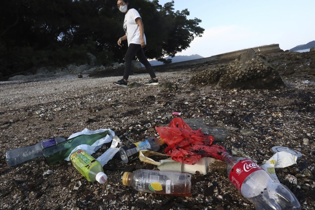 June Wong So-kwan picks up plastic waste on Hong Kong’s beaches, but is the city doing enough to reduce the amount of plastic that washes into the ocean? Photo: Jonathan Wong