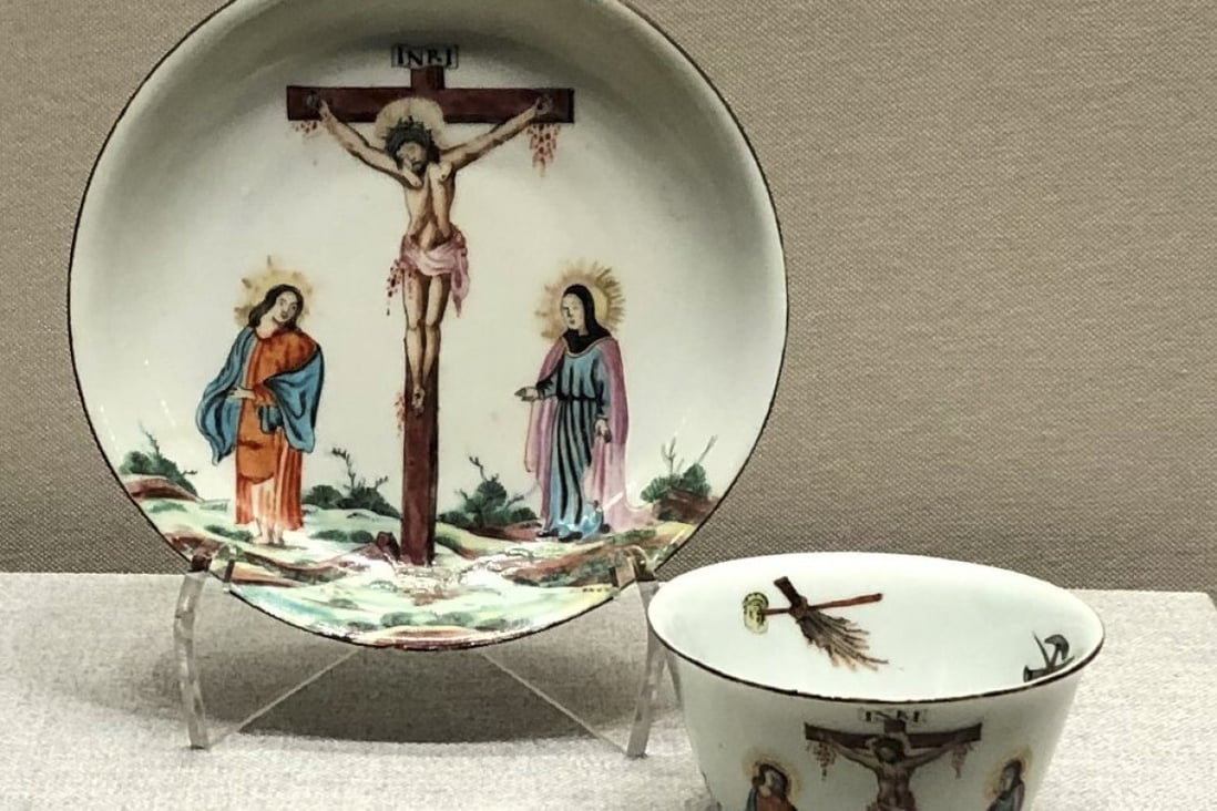 This 18th-century cup and saucer set, part of the CUHK art museum exhibition, was first made in China without decoration and then fired with overglaze painting in the Netherlands. Both the cup and saucer depict the crucifixion of Jesus Christ. Photo: Enid Tsui