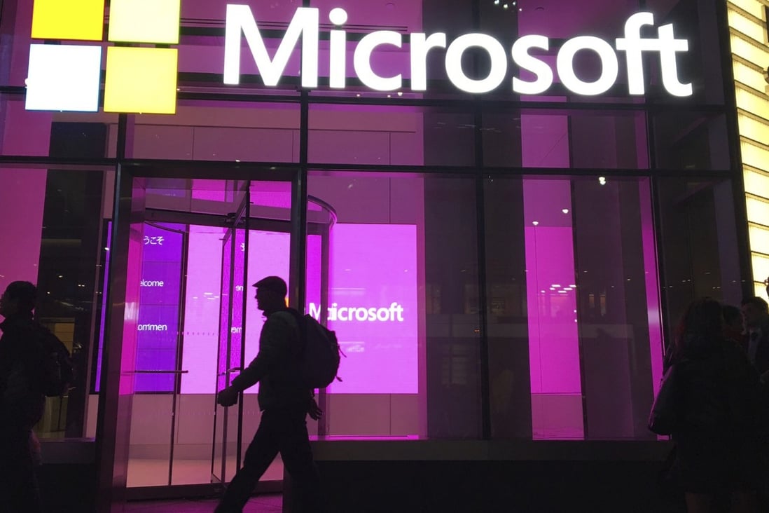 People walk near a Microsoft office in New York in November, 2016. Large tech firms such as Microsoft have been accused of stifling innovation through their acquisitions and competitive practices. Photo: AP