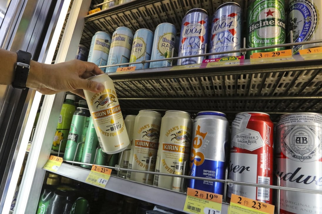 A man picks out beer inside a shop in Central in June 2017. Photo: Felix Wong