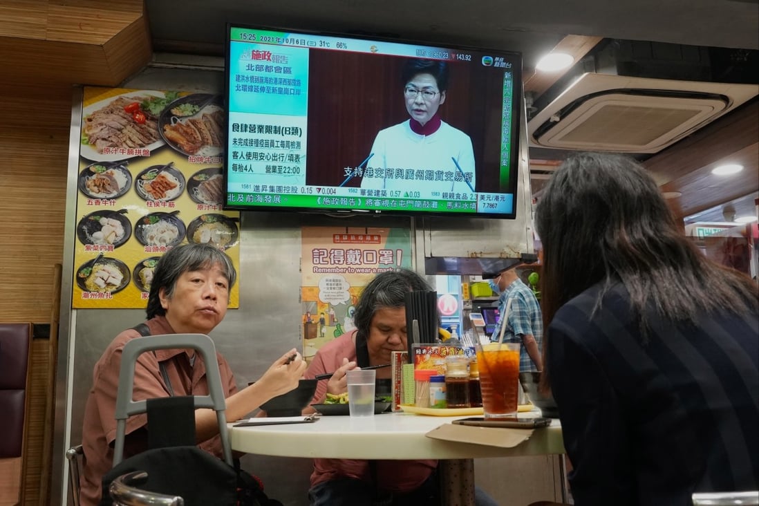 A TV screen in a cha chaan teng shows Chief Executive Carrie Lam delivering her policy address on October 6. Photo: AP