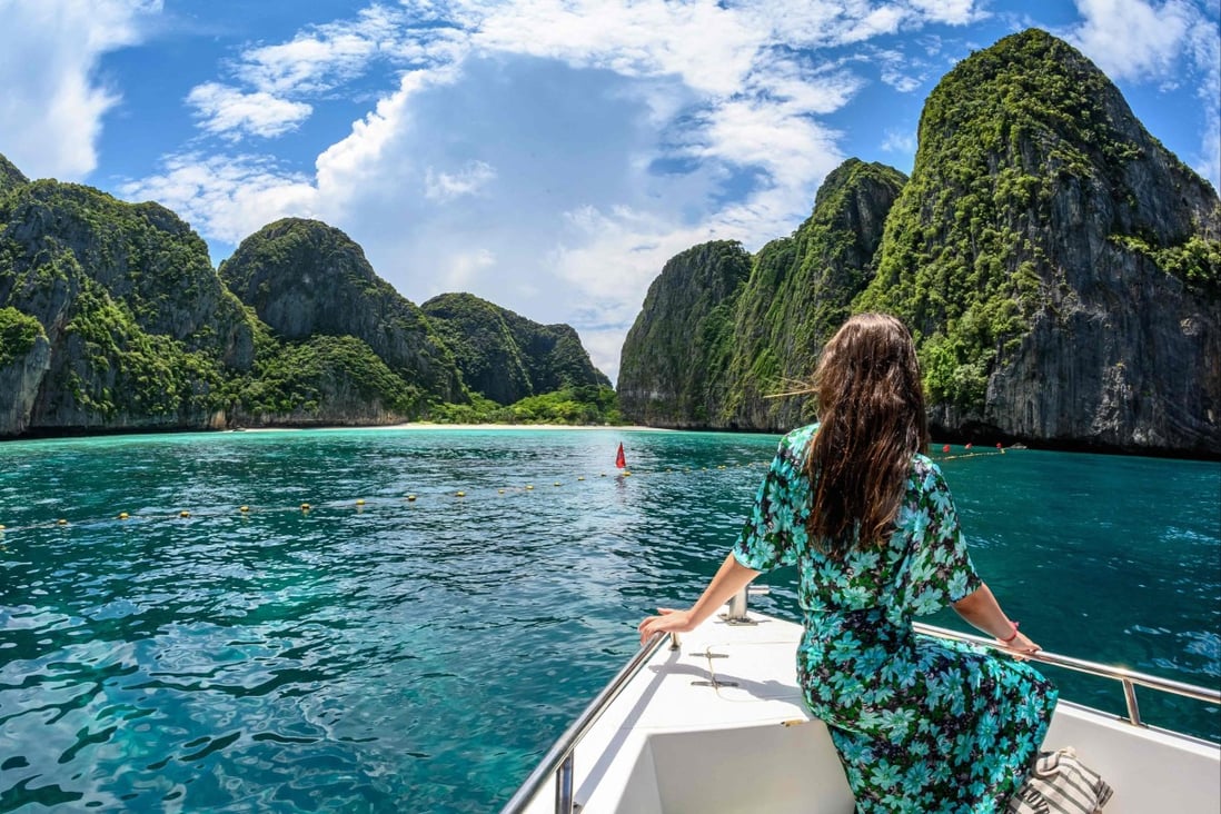 A tourist on a boat on the southern Thai island of Koh Phi Phi in 2019. Photo: AFP