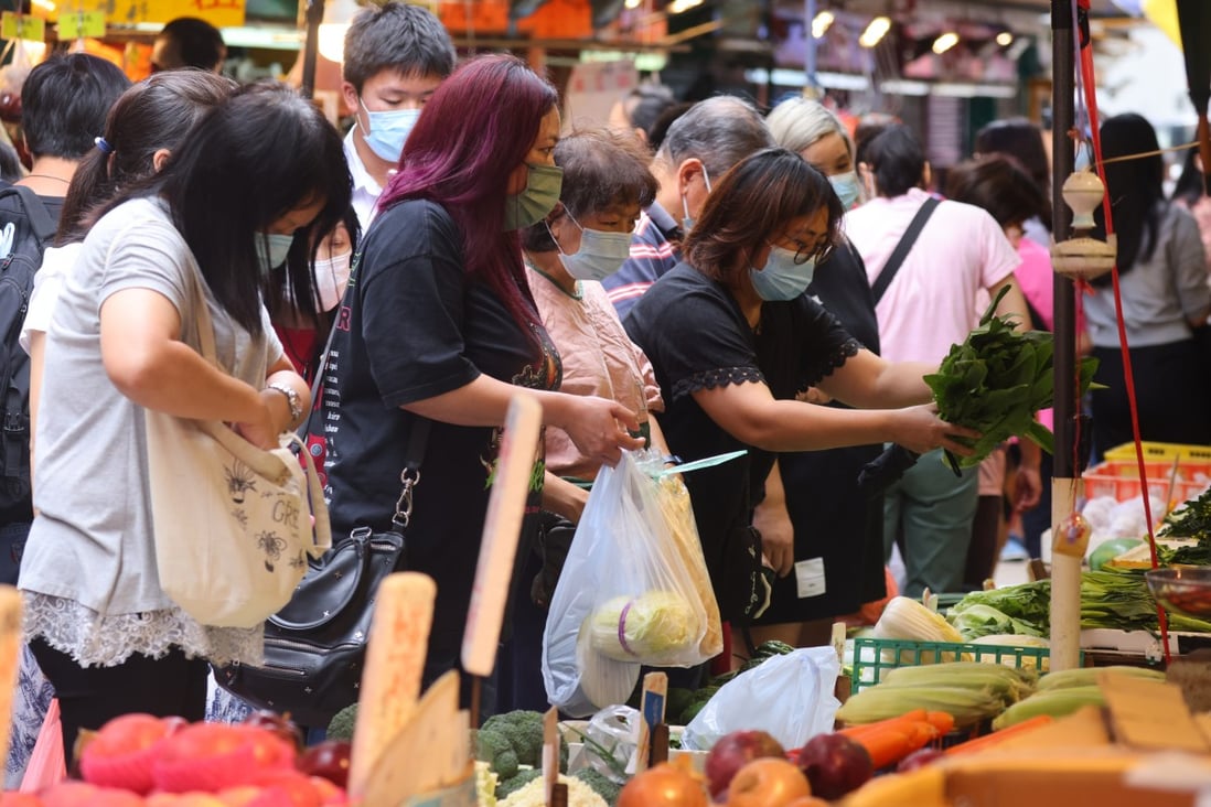 People rush to buy food at a market in Mong Kok as Tropical Storm Kompasu nears Hong Kong on October 12. CEOs in Asia fear that rising prices could dampen consumer sentiment. Photo: Dickson Lee