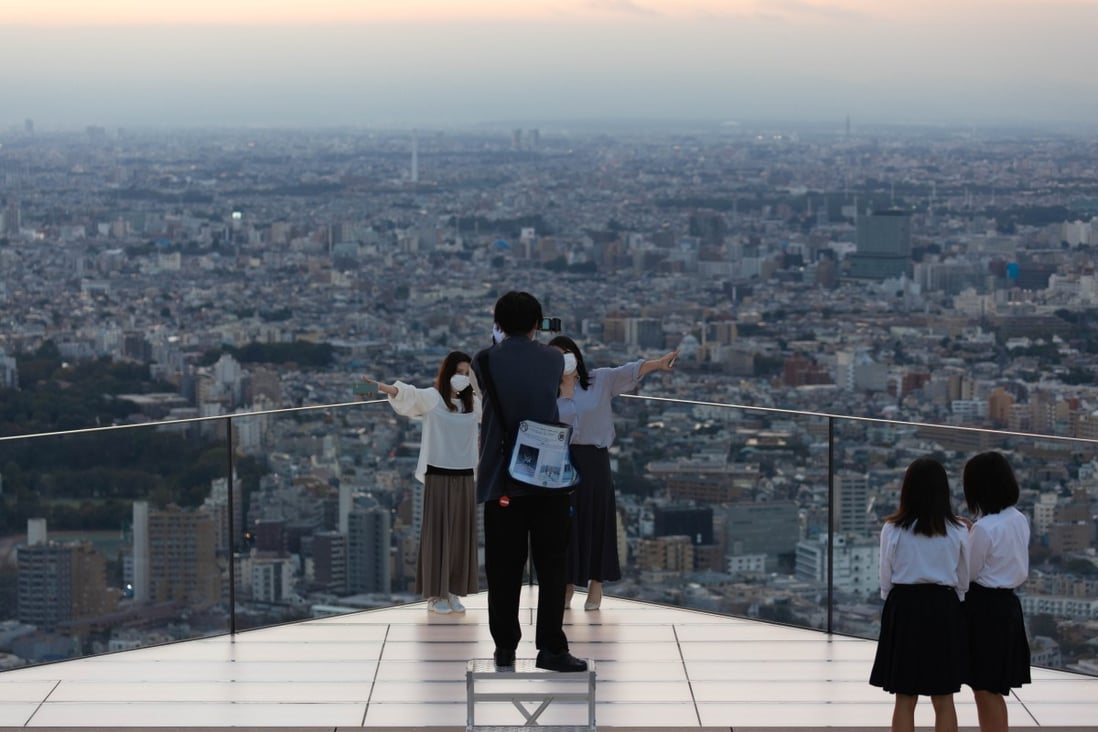 Visitors on the observation deck of the Shibuya Sky tower in Tokyo. Japan is looking to attract nearly twice as many visitors by 2030 as it did in 2019. Photo: Getty Images
