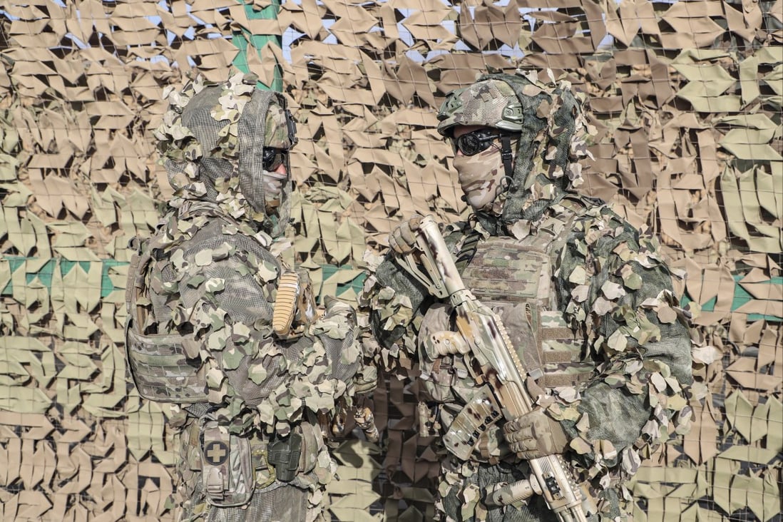 Camouflaged Russian soldiers take part in a joint anti-terrorist exercise with the armed forces of the Shanghai Cooperation Organization member states. Photo: EPA