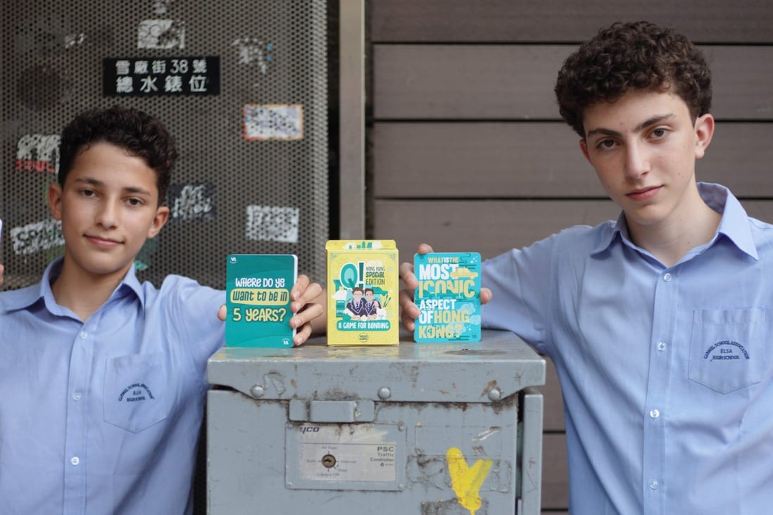 Alex Wigisser (left) and Gabriel Wigisser  have devised a card game to help quarantined guests in Hong Kong connect more deeply inside and outside their hotels. Photo: Winson Wong