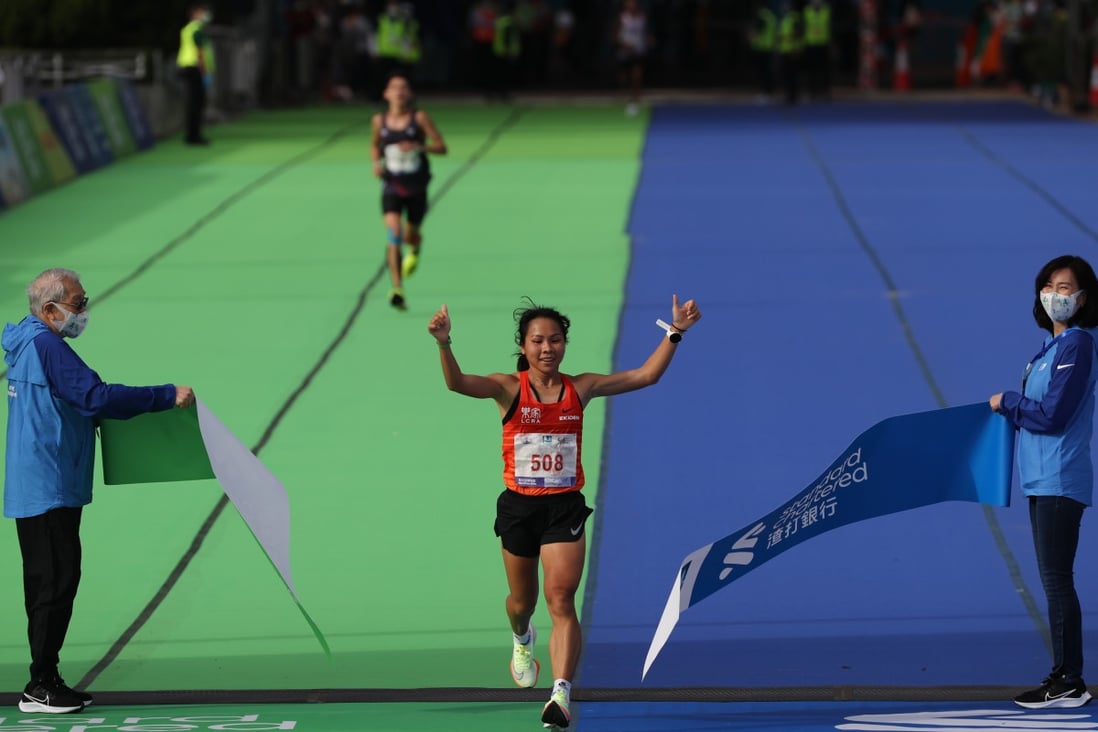 Women’s marathon champion Christy Yiu Kit-ching arrives at the Standard Chartered Hong Kong Marathon finish line at Victoria Park in Causeway Bay on October 24. Photo: Nora Tam