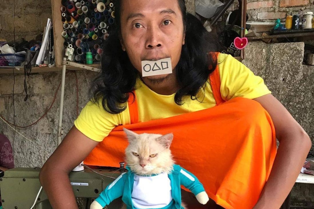 Cat fashion designer Fredi Lugina and one of his his models in Squid Game-inspired costumes. Photo: Instagram