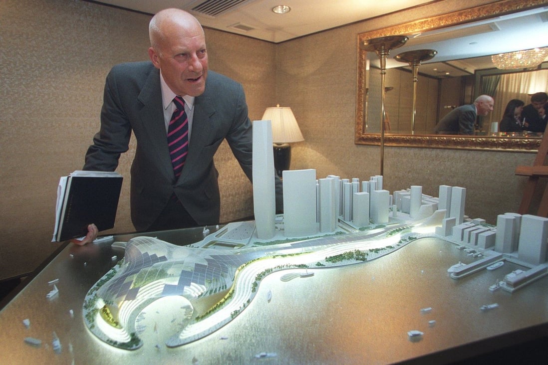 British architect Norman Foster stands next to a model of his winning proposal for the West Kowloon cultural and entertainment complex in 2002. His plan was scrapped in 2006 on cost grounds, but his firm won the tender to implement a revised blueprint in 2011. Photo: SCMP