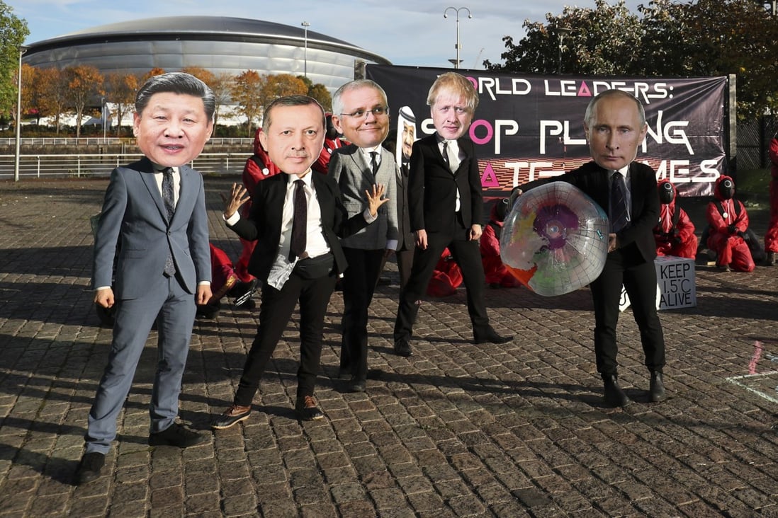Climate campaigners enact a ‘Squid Game’ themed protest stunt wearing masks of world leaders including Chinese President Xi Jinping, Turkish President Recep Tayyip Erdogan, Australian Prime Minister Scott Morrison, Saudi Arabia’s King Salman, British Prime Minister Boris Johnson and Russian President Vladimir Putin, on the fringes of the COP26 UN Climate Summit in Glasgow. Photo: AP