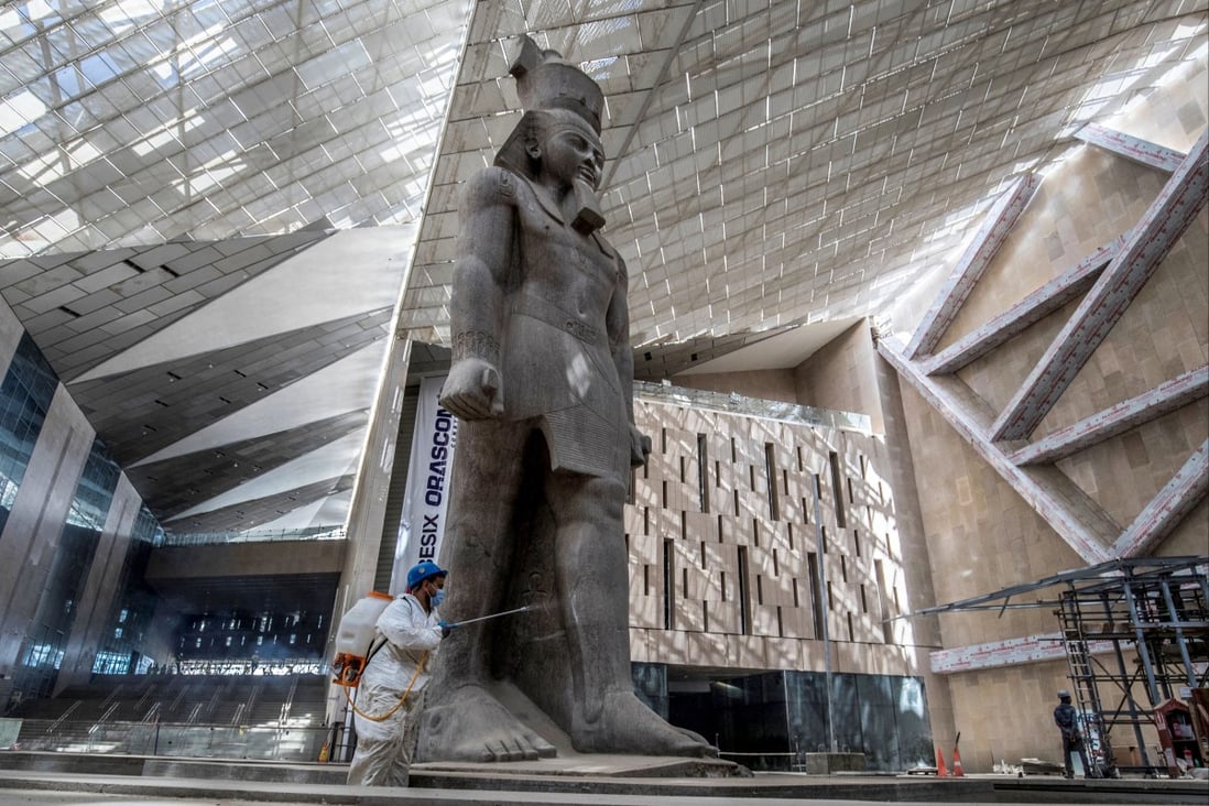 A 3,200-year-old pink-granite colossal statue of King Ramses II at the entrance of the the Grand Egyptian Museum in Giza, Egypt. Set to open in 2022, it is one of a number of new museums around the world. Photo: AFP