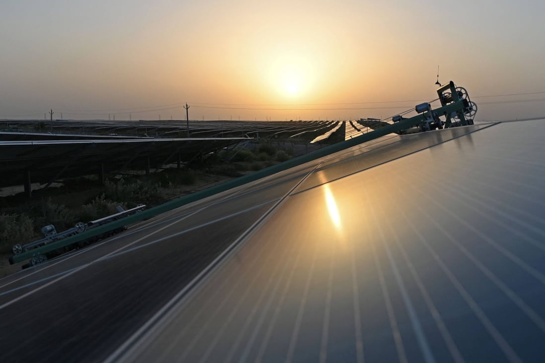A robot cleans panels at a solar power plant in the Indian state of Rajasthan. Photo: AFP