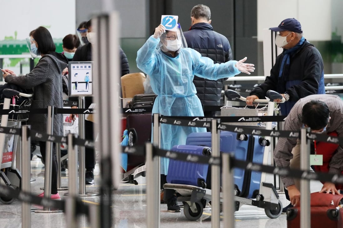 A passenger from London arrives at Hong Kong airport on December 22 last year, after Hong Kong announced a ban on all passenger flights from Britain in bid to stop a mutated strain of Covid-19 from reaching the city. The possibility of flight bans, in addition to lengthy quarantine, makes travel into Hong Kong a journey fraught with pitfalls. Photo: Nora Tam