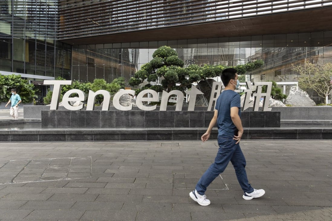 A pedestrian near signage for Tencent Holdings Ltd. at the company’s headquarters in Shenzhen, China, on Tuesday, Oct. 12, 2021. Photo: Bloomberg