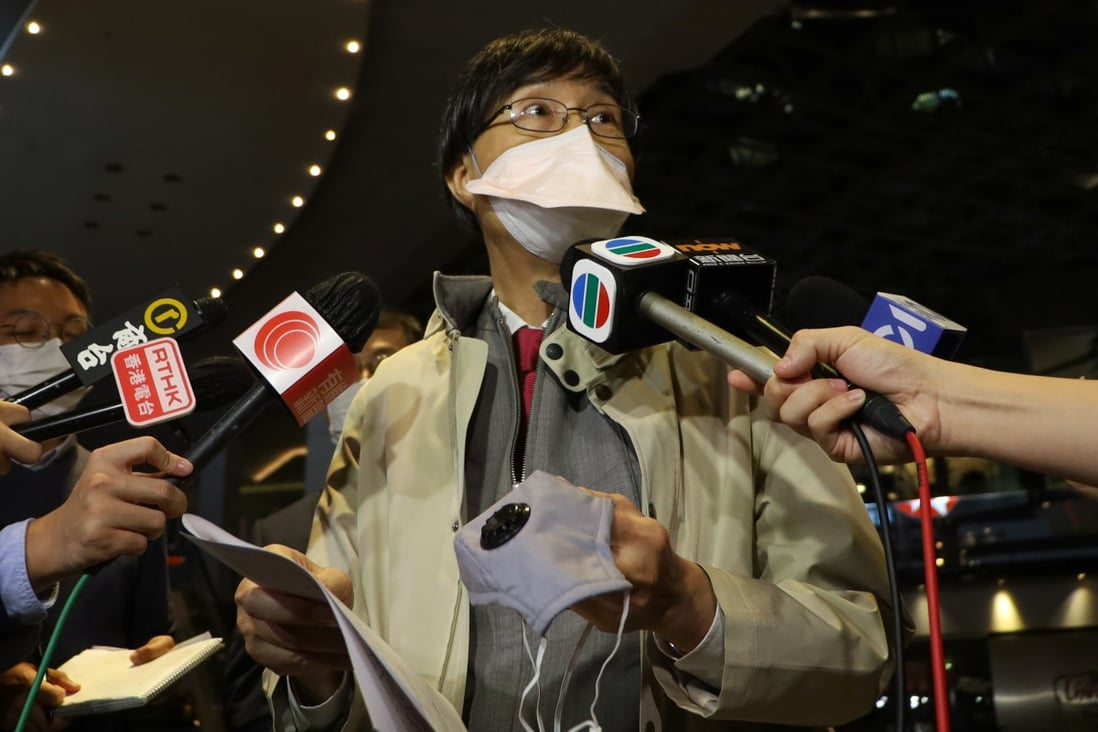 Professor Yuen Kwok-yung holds a valve-style mask similar to one blamed for a recent quarantine cross-infection while speaking to the press on Monday night. Photo: Handout
