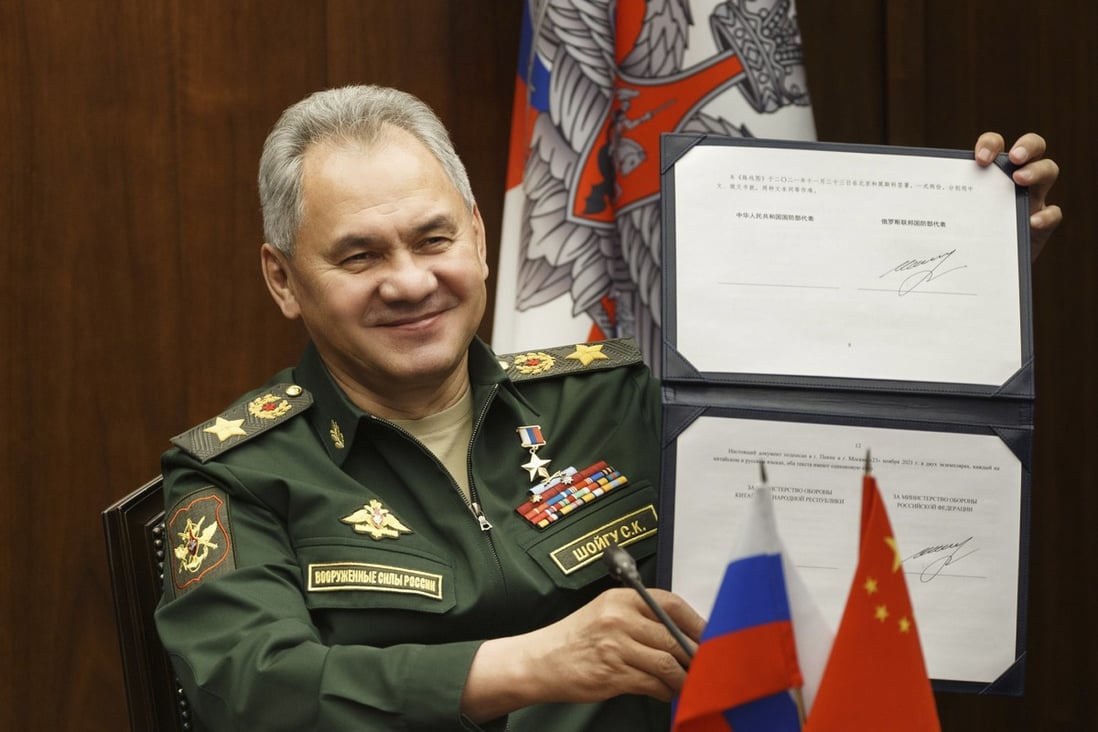 Russian Defence Minister Sergei Shoigu shows his signature on a road map for military cooperation between Russia and China during a video call with his Chinese counterpart on Tuesday. Photo: AP