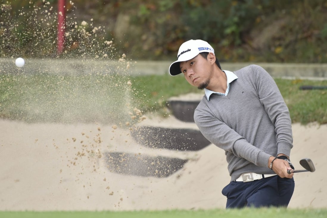 Terrence Ng plays out of a bunker on the New Course during the opening round of the Fanling Trophy. Photos: Hong Kong Golf Club