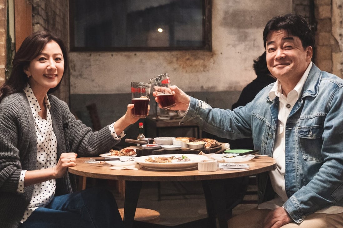 Chef and presenter Paik Jong-won (right) chats with Korean celebrities including actress Kim Hee-ae (left) over soju and snacks in Netflix’s Paik’s Spirit.. Photo: Netflix