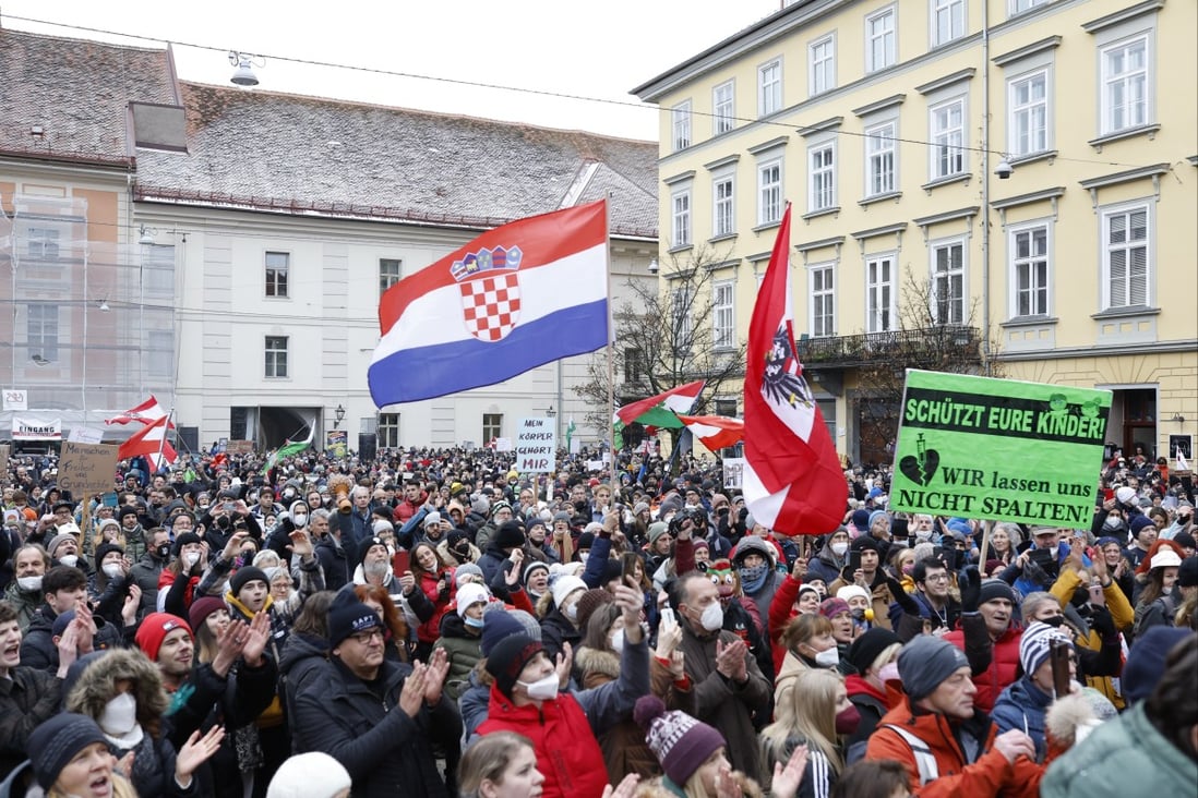 People take part in a demonstration in Graz, Austria on Saturday against the government’s coronavirus measures. Photo: APA / DPA