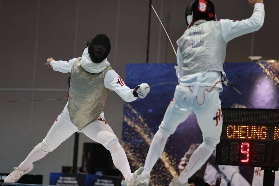 Cheung Ka-long (left) attacks Ryan Choi Chun-yin during the men’s final of the Hong Kong Open. Photo: K. Y. Cheng