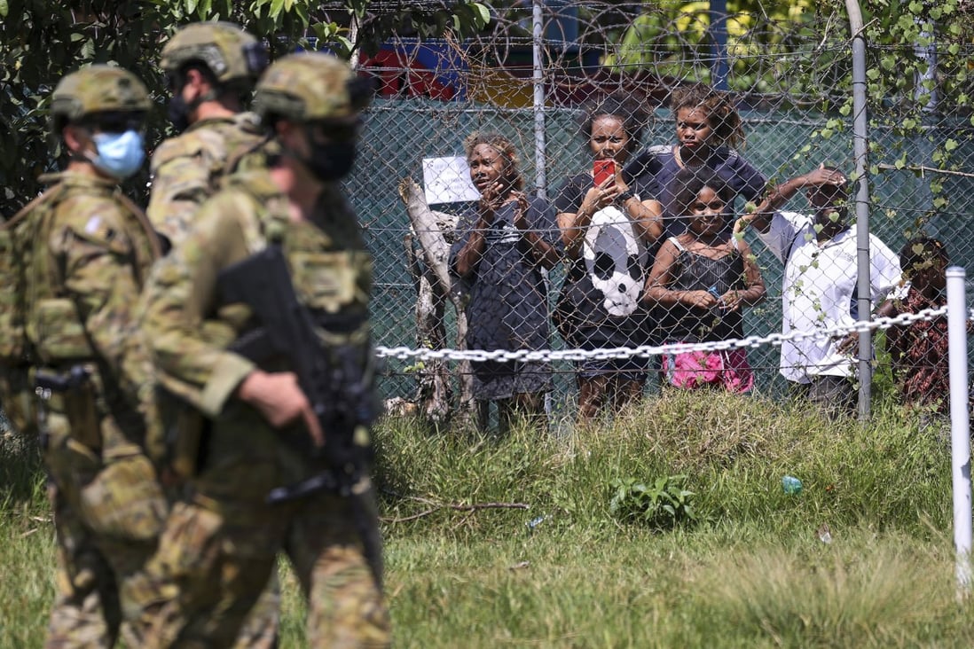 Australian soldiers and police patrol the streets in Honiara, Solomon Islands. Photo: AP 