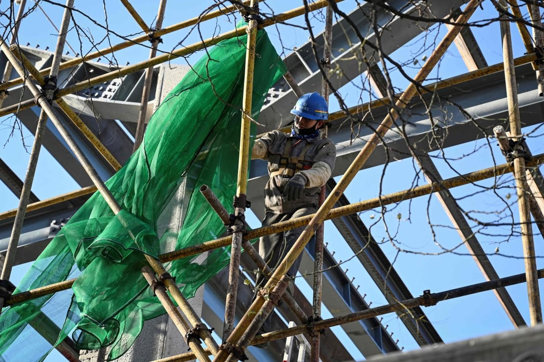 China’s official non-manufacturing PMI, which measures business sentiment in the services and construction sectors, fell to 52.3 in November from 52.4 in October. Photo: AFP