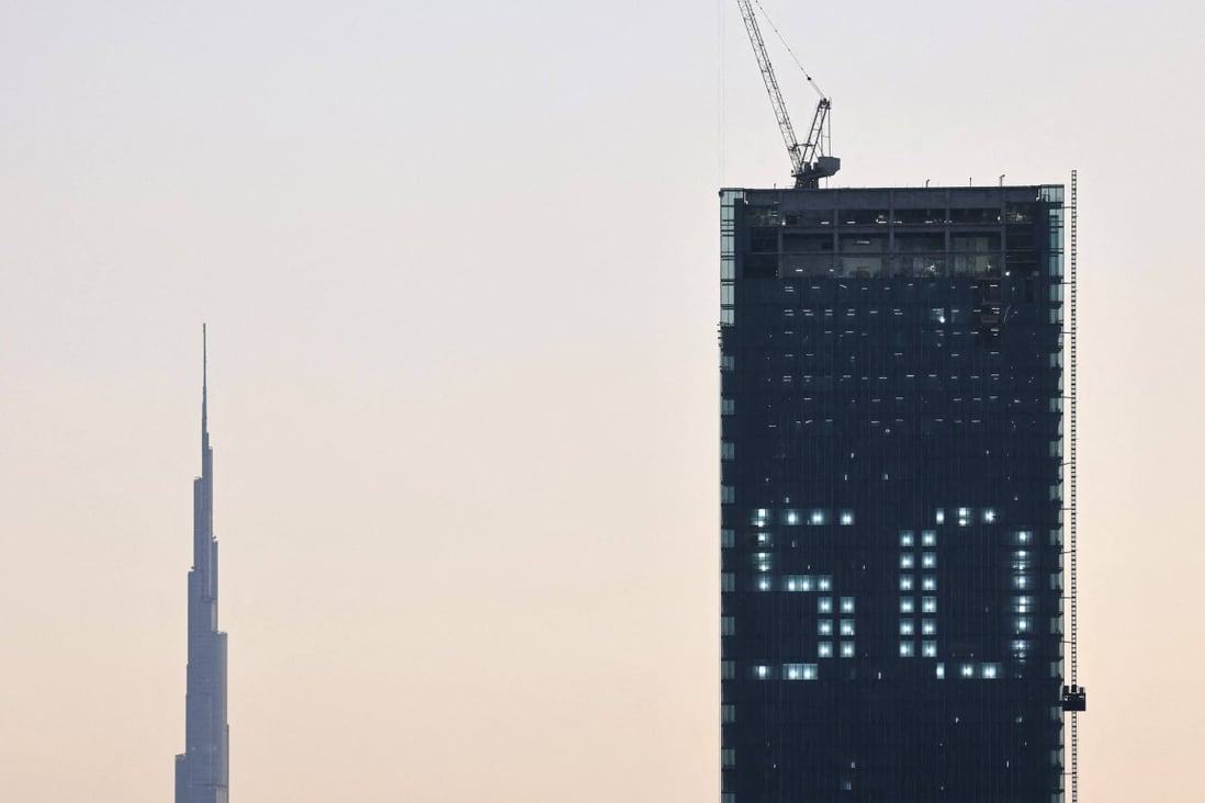 The number 50 is displayed on a building in the Gulf emirate if Dubai with the Burj Khalifa in the background. Photo: AFP