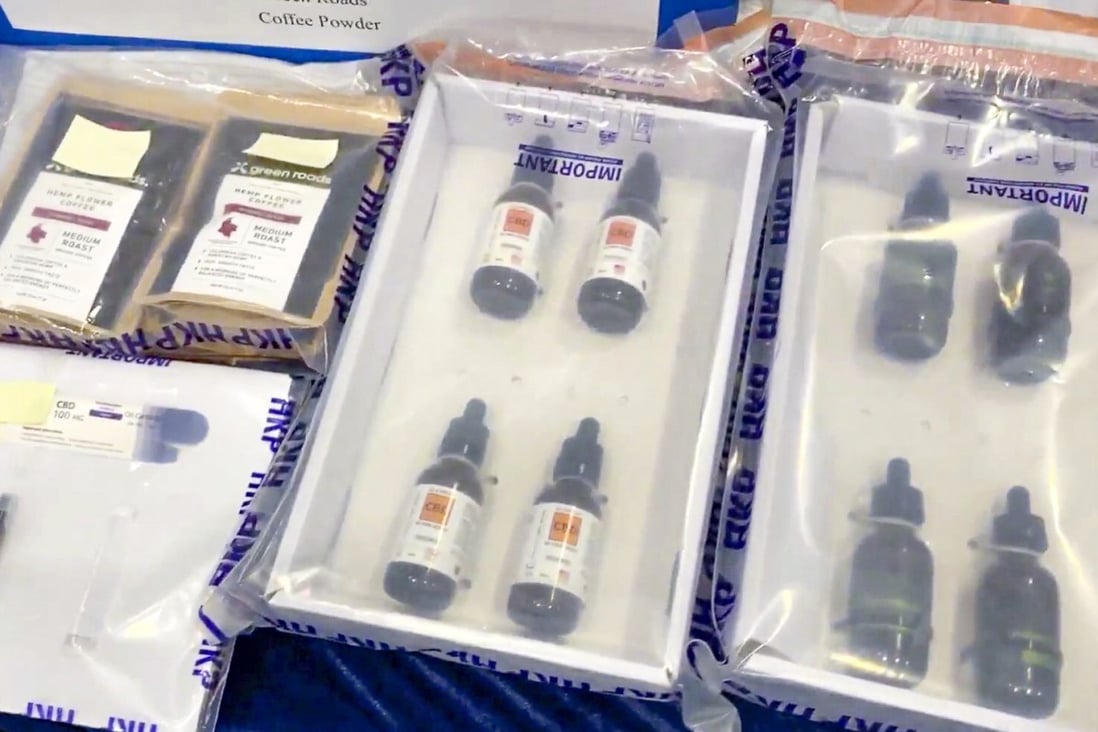Police display bottles of CBD products that were seized after being found to contain traces of THC. Photo: Facebook