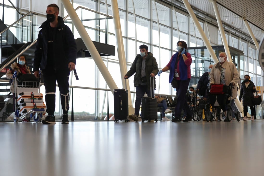 People walk inside Schiphol Airport after Dutch health authorities said that 61 people who arrived in Amsterdam on flights from South Africa tested positive for Covid-19. Photo: Reuters