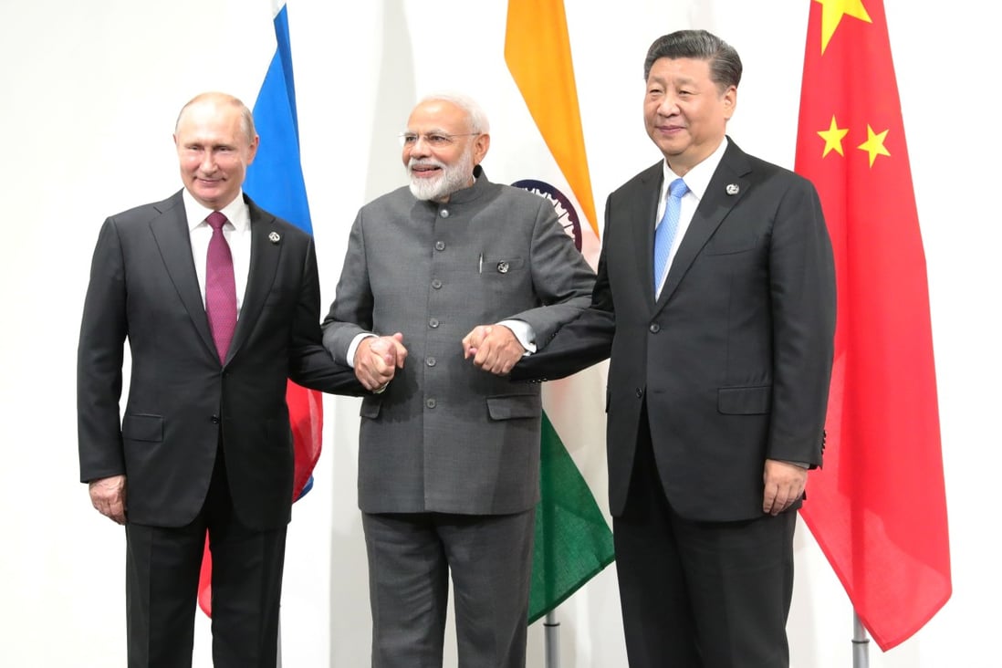 Russian President Vladimir Putin (left), Indian Prime Minister Narendra Modi (centre) and Chinese President Xi Jinping meet on the sidelines of the G20 summit in Osaka, Japan, on June 28, 2019. While India has been drawing closer to the US, it has signalled its support of China hosting the Winter Olympics and continues to buy military equipment from Russia. Photo:Reuters